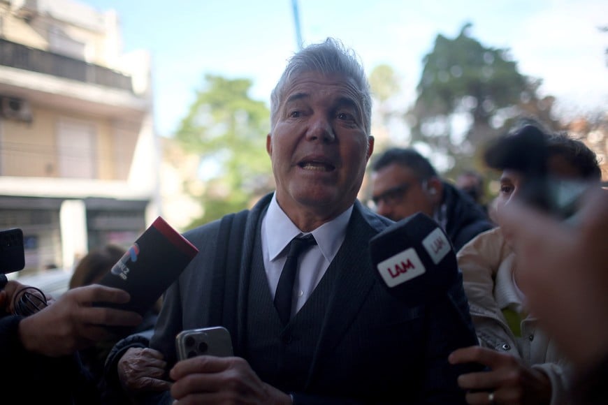 Fernando Burlando, lawyer for the daughters of late Argentine soccer legend Diego Maradona, speaks with media as he arrives at the San Isidro court before a hearing to determine the future of soccer legend Diego Maradona's trial, after one of the three presiding judges stood down from the case amid accusations of ethical breaches, in San Isidro, on the outskirts of Buenos Aires, Argentina, May 29, 2025. REUTERS/Agustin Marcarian