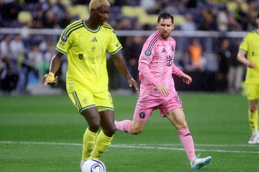 Mar 11, 2026; Nashville, Tennessee, USA;  Nashville SC defender Maxwell Woledzi (3) looks to pass the ball past Inter Miami CF forward  Lionel Messi (10) during their 2026 Concacaf Champions Cup Round of 16 Leg 1 game at GEODIS Park. Mandatory Credit: Alan Poizner-Imagn Images
