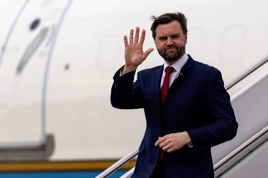 U.S. Vice President JD Vance waves as he deplanes from Air Force Two at Joint Base Andrews, Maryland, U.S., March 13, 2026. Kent Nishimura/Pool via REUTERS
