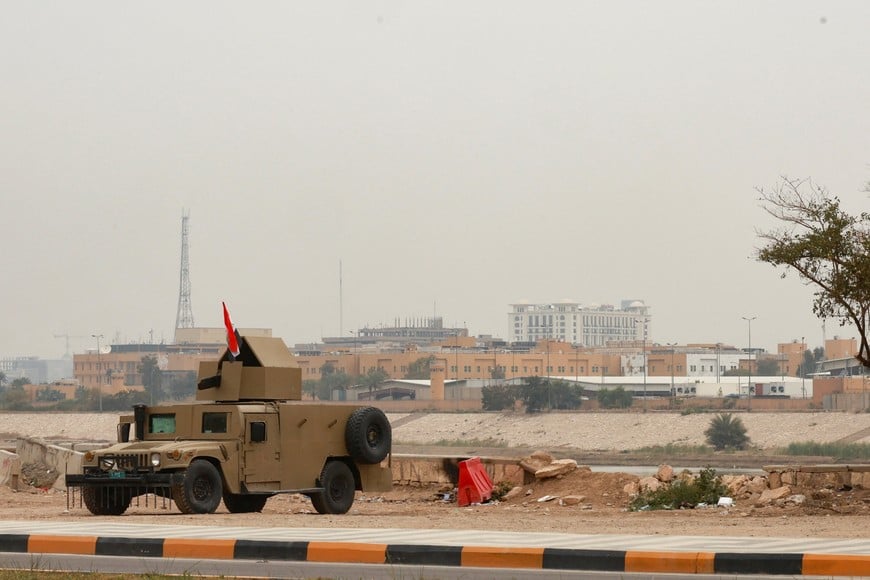 An Iraqi army Humvee stands guard near the U.S. Embassy, after Iraqi security sources said the embassy was hit in a missile attack, in Baghdad, Iraq, March 14, 2026. REUTERS/Ahmed Saad