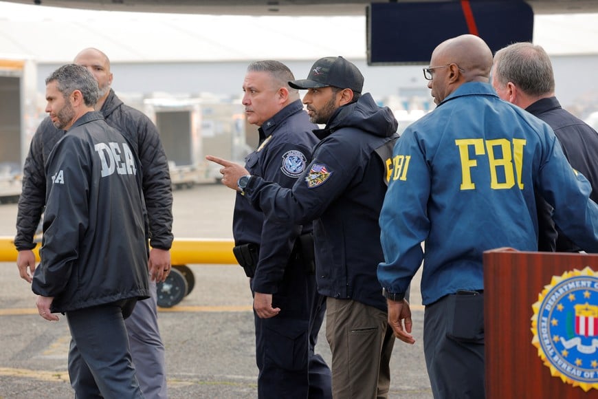 Akil Davis, Assistant Director in Charge of the FBI Los Angeles Field Office walks with FBI Director Kash Patel, following a press conference to announce the apprehension of Ryan Wedding, a former Canadian Olympic snowboarder who was on the FBI's Ten Most Wanted Fugitive list, in Ontario, California, U.S., January 23, 2026.   REUTERS/Mike Blake