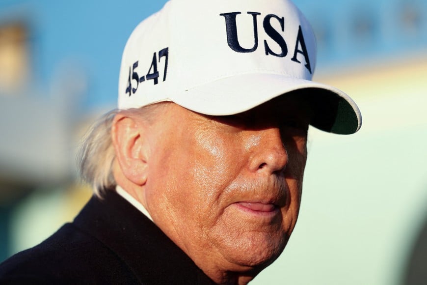 U.S. President Donald Trump looks on before boarding Air Force One for travel to Florida, at Joint Base Andrews, Maryland, U.S., March 13, 2026. REUTERS/Kevin Lamarque
