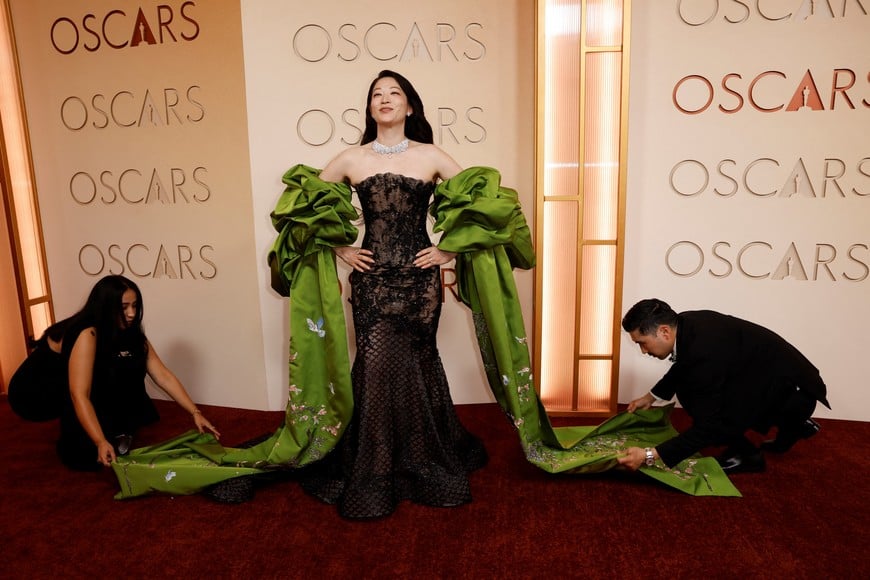 Arden Cho poses on the red carpet during the Oscars arrivals at the 98th Academy Awards in Hollywood, Los Angeles, California, U.S., March 15, 2026. REUTERS/Caroline Brehman