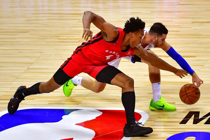 Aug 8, 2021; Las Vegas, Nevada, USA; Toronto Raptors forward Scottie Barnes (4) recovers a loose ball from New York Knicks guard Luca Vildoza (17) during an NBA Summer League game at Thomas & Mack Center. Mandatory Credit: Stephen R. Sylvanie-USA TODAY Sports