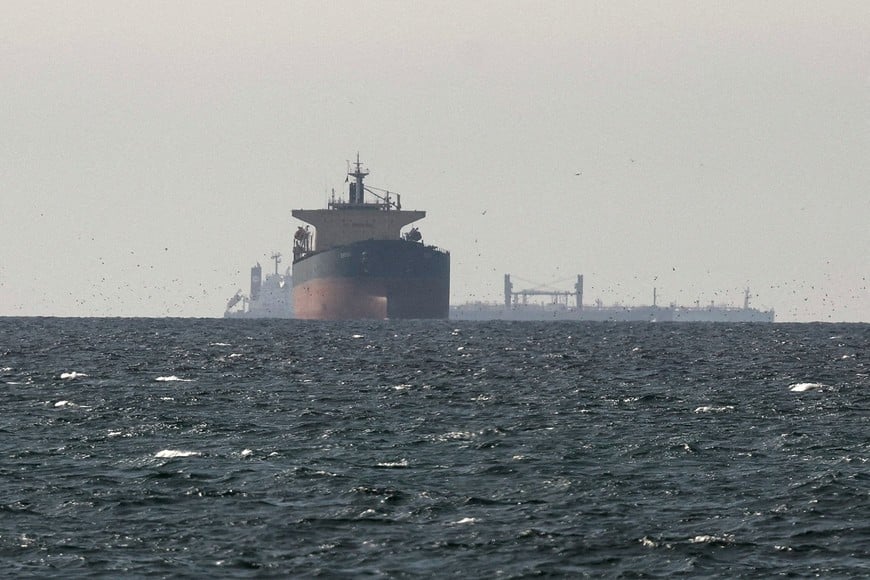 FILE PHOTO: Tankers sail in the Gulf, near the Strait of Hormuz, as seen from northern Ras al-Khaimah, near the border with Oman’s Musandam governance, amid the U.S.-Israeli conflict with Iran, in United Arab Emirates, March 11, 2026. REUTERS/Stringer/File Photo
