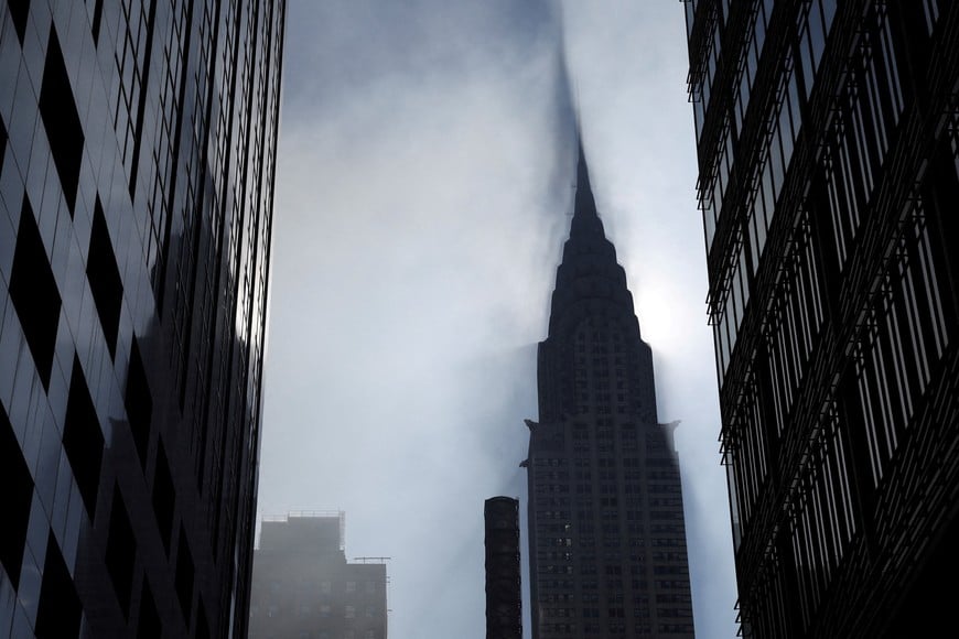 Smoke billows next to the Chrysler Building in midtown Manhattan, New York, U.S., March 17, 2026. REUTERS/Shannon Stapleton     TPX IMAGES OF THE DAY