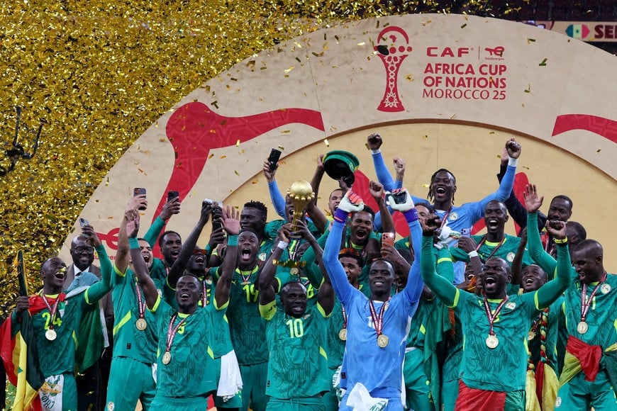 FILE PHOTO: Soccer Football - CAF Africa Cup of Nations - Morocco 2025 - Final - Senegal v Morocco - Prince Moulay Abdellah Stadium, Rabat, Morocco - January 18, 2026
Senegal's Sadio Mane lifts the trophy with teammates as they celebrate after winning the Africa Cup of Nations REUTERS/Amr Abdallah Dalsh/File Photo