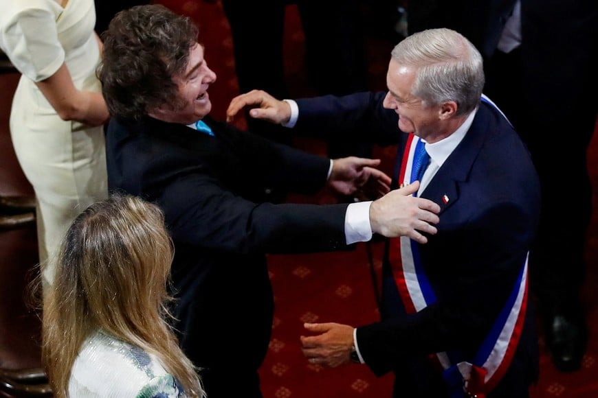 Argentina's President Javier Milei congratulates Chile's President Jose Antonio Kast, wearing the presidential sash,  during Kast's swearing-in ceremony, at the Congress, in Valparaiso, Chile, March 11, 2026. REUTERS/Rodrigo Garrido