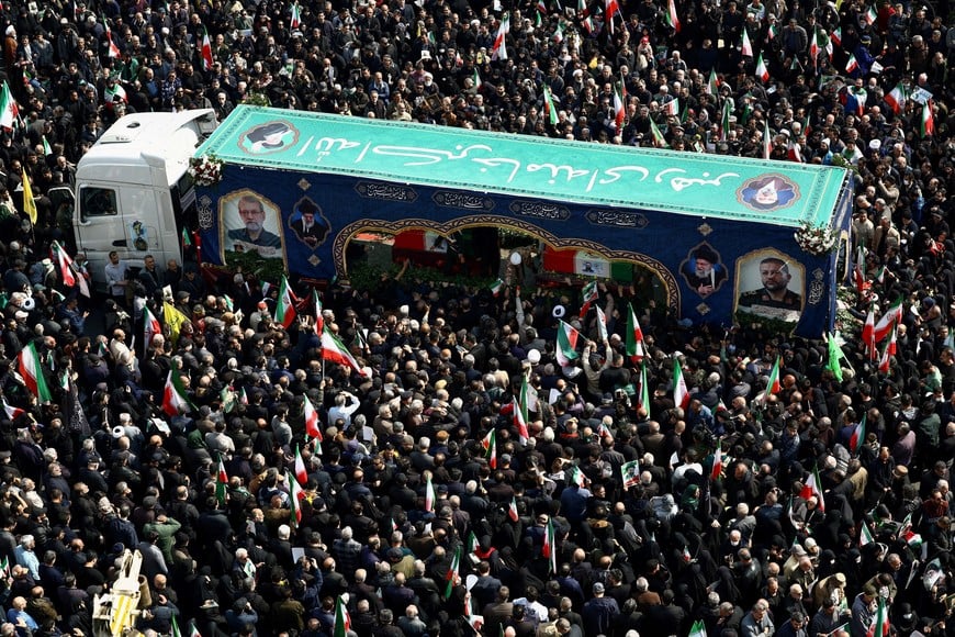 People gather for the funeral of Iranian security chief Ali Larijani and victims of the IRIS Dena warship at Enghelab Square, amid the U.S.-Israeli conflict with Iran, in Tehran, Iran, March 18, 2026. Majid Asgaripour/WANA (West Asia News Agency) via REUTERS ATTENTION EDITORS - THIS PICTURE WAS PROVIDED BY A THIRD PARTY.