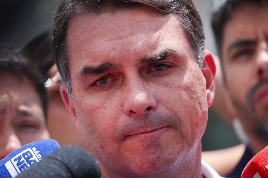 Senator Flavio Bolsonaro attends a press conference outside a hospital, as his father, Brazil's former President Jair Bolsonaro is hospitalized, while serving a 27-year sentence for plotting a coup against his successor, President Luiz Inacio Lula da Silva, in Brasilia, Brazil, March 13, 2026. REUTERS/Adriano Machado