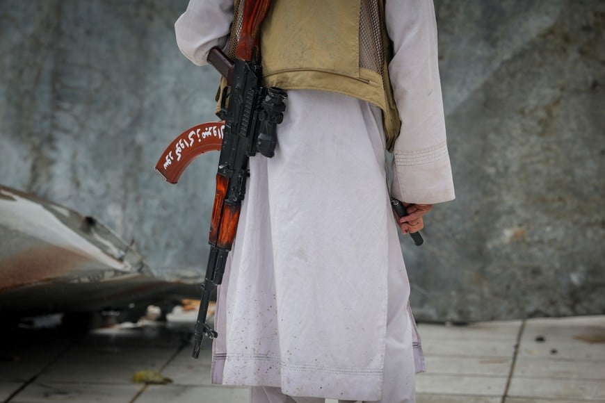 A Taliban security personnel guards the site of a drug rehabilitation centre destroyed in what the Taliban said was a Pakistani air strike in Kabul, Afghanistan, March 18, 2026. REUTERS/Sayed Hassib