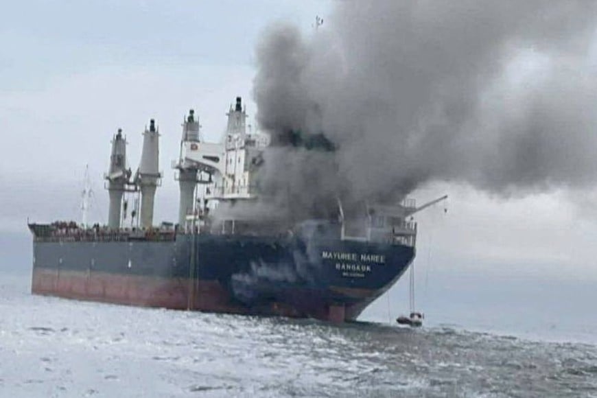 The Thailand-flagged cargo ship Mayuree Naree engulfed in black smoke in the Strait of Hormuz, March 11, 2026.  ROYAL THAI NAVY/Handout via REUTERS    THIS IMAGE HAS BEEN SUPPLIED BY A THIRD PARTY. NO RESALES. NO ARCHIVES. MANDATORY CREDIT

VERIFICATION:
- Identity of the vessel confirmed as Thai-flagged bulk carrier Mayuree Naree from IMO number, hull and superstructure seen in the images which matched file imagery of the vessel   
- Location confirmed as off north coast of Oman, in Strait of Hormuz, from ship tracking data from captured March 11
- Royal Thai Navy and United Kingdom Maritime Trade Operations reported that a cargo vessel was hit by an unknown projectile in the Strait of Hormuz on March 11
- Thailand-flagged bulk carrier Mayuree Naree was targeted and damaged approximately 11 nautical miles north of Oman, two maritime security sources said.