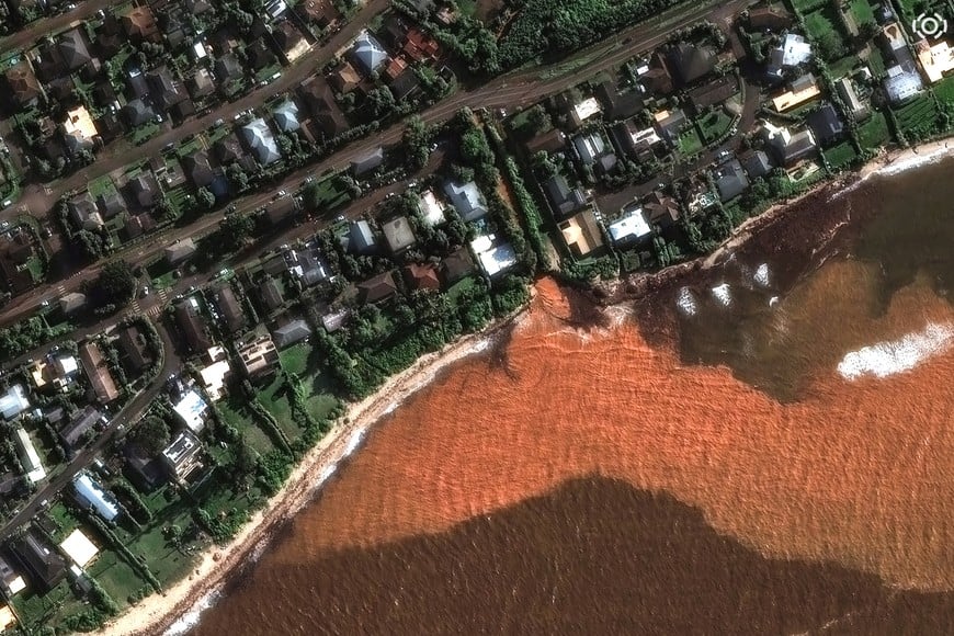 A satellite image shows storm sediment and mud flowing into the ocean near Waialua, Hawaii, U.S., March 23, 2026, as the state experiences its worst flooding in more than 20 years. Vantor/Handout via REUTERS THIS IMAGE HAS BEEN SUPPLIED BY A THIRD PARTY. NO RESALES. NO ARCHIVES. MANDATORY CREDIT. MUST NOT OBSCURE LOGO.