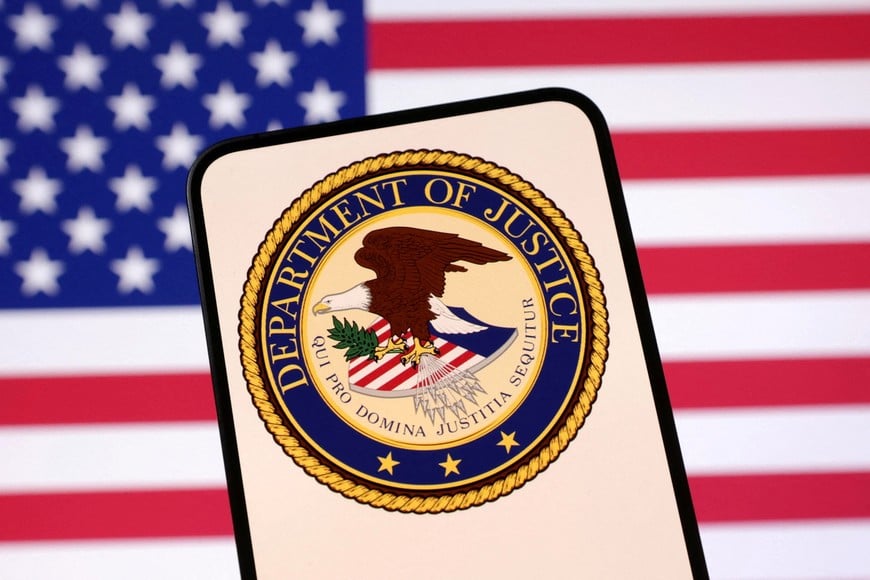FILE PHOTO: United States Department of Justice logo and U.S. flag are seen in this illustration taken April 23, 2025. REUTERS/Dado Ruvic/Illustration/File Photo