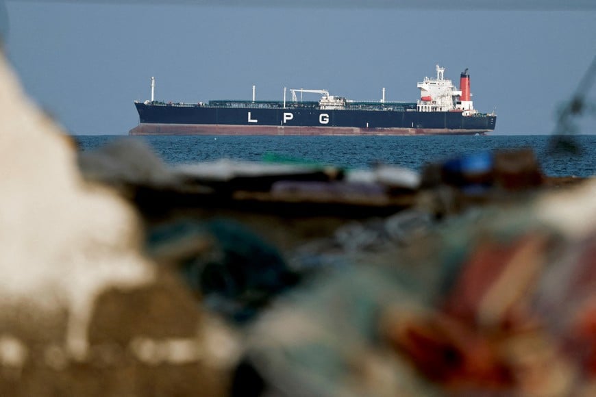 FILE PHOTO: An LPG gas tanker at anchor as traffic is down in the Strait of Hormuz, amid the U.S.-Israeli conflict with Iran, in Shinas, Oman, March 11, 2026. REUTERS/Benoit Tessier/File Photo