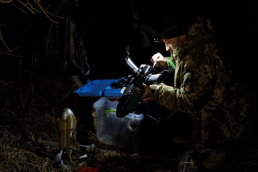 Yuriy, service member of an air defence unit of the 420th Khort Separate Unmanned Systems Battalion prepares to fly P1-Sun and Sting FPV interceptor drones during his combat shift, amid Russia's attack on Ukraine, in Kharkiv region, Ukraine March 17, 2026. REUTERS/Valentyn Ogirenko