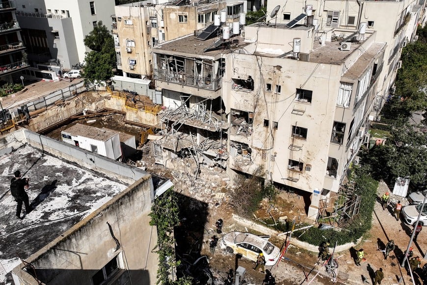 A drone view of emergency personnel working at a site following Iranian missile barrages in central Israel, amid the U.S.-Israel conflict with Iran, in Tel Aviv, Israel, March 24, 2026. REUTERS/Roei Kastro     TPX IMAGES OF THE DAY
