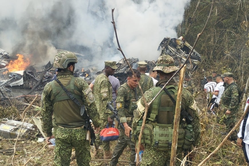 Members of the military gather at the site of a Colombian military plane crash in Puerto Leguizamo, Putumayo, Colombia March 23, 2026. La Voz de Amazonia/Mare Rafue/Handout via REUTERS    THIS IMAGE HAS BEEN SUPPLIED BY A THIRD PARTY. MANDATORY CREDIT
 
VERIFICATION: 
Topography mapping and nearby buildings matched satellite imagery
Date verified by original file metadata
Defense Minister Pedro Sanchez said the accident happened as the Lockheed Martin-built LMT.N Hercules C-130 was taking off from Puerto Leguizamo on the border with Peru