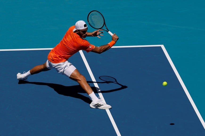 Mar 23, 2026; Miami Gardens, FL, USA; Francisco Cerundolo (ARG) reaches for a backhand against Daniil Medvedev (not pictured) on day 7 of the 2026 Miami Open at Hard Rock Stadium. Mandatory Credit: Geoff Burke-Imagn Images