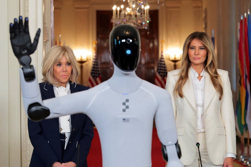U.S. first lady Melania Trump looks on next to Brigitte Macron, the wife of French President Emmanuel Macron, as she hosts a roundtable event on the second day of the inaugural Fostering the Future Together Global Coalition Summit, at the White House in Washington, D.C., U.S., March 25, 2026. REUTERS/Kylie Cooper