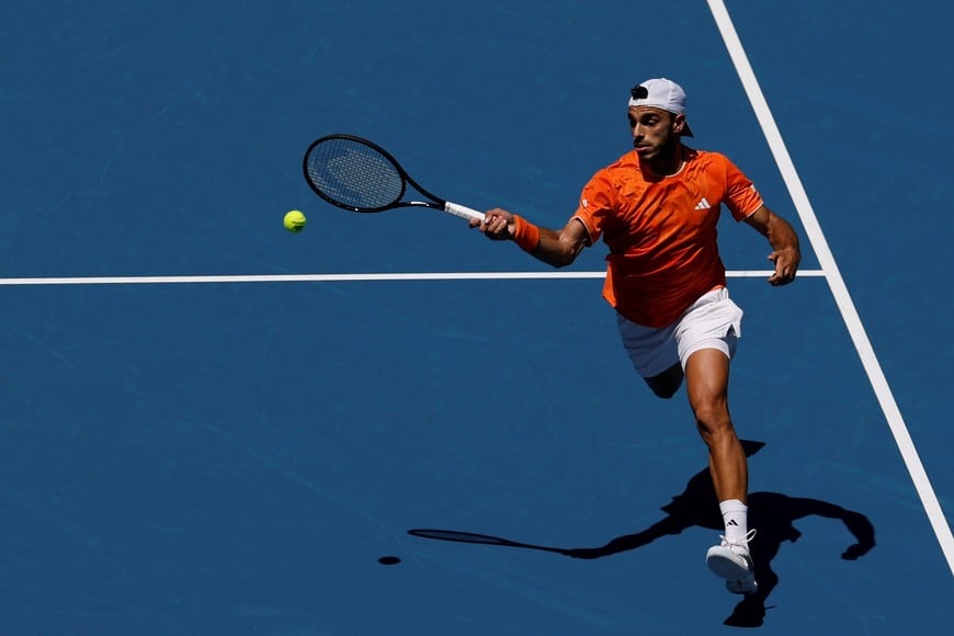 Mar 23, 2026; Miami Gardens, FL, USA; Francisco Cerundolo (ARG) hits a forehand against Daniil Medvedev (not pictured) on day 7 of the 2026 Miami Open at Hard Rock Stadium. Mandatory Credit: Geoff Burke-Imagn Images