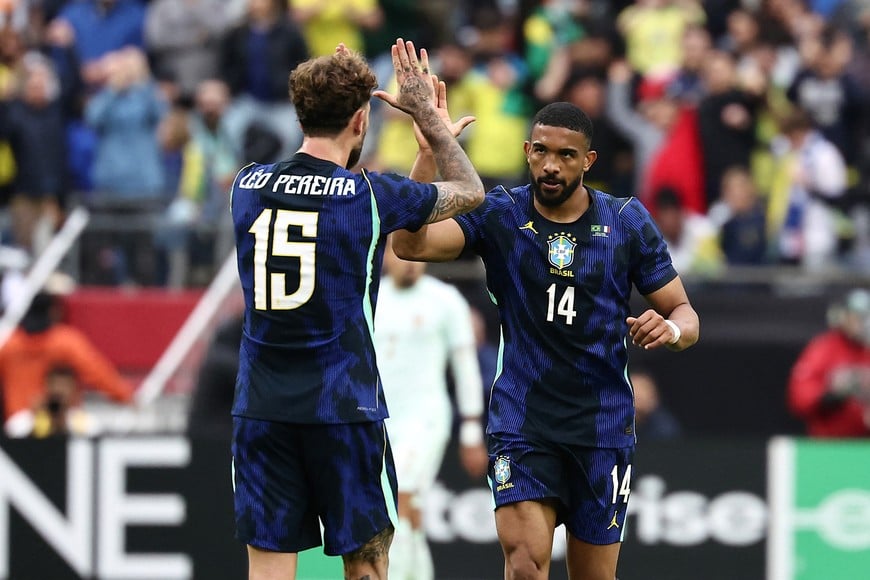 Mar 26, 2026; Foxborough, Massachusetts, USA; Brazil forward Gleison Bremer (14) celebrates his goal with defender Leo Pereira (15) during the second half at Gillette Stadium. Mandatory Credit: Winslow Townson-Imagn Images