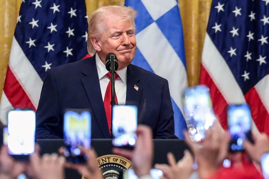 U.S. President Donald Trump attends a celebration in honor of Greek Independence Day in the East Room of the White House in Washington, D.C., U.S., March 26, 2026. REUTERS/Evelyn Hockstein