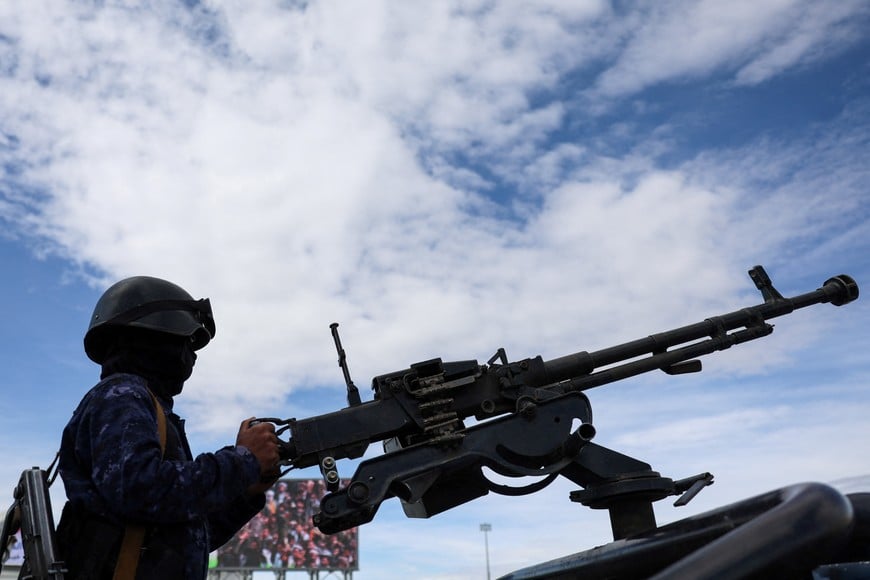 Houthi police trooper mans a machine gun mounted on a patrol vehicle at the site of a rally in solidarity with Iran, as the U.S.-Israeli conflict with Iran continues, in Sanaa, Yemen, March 27, 2026. REUTERS/Khaled Abdullah