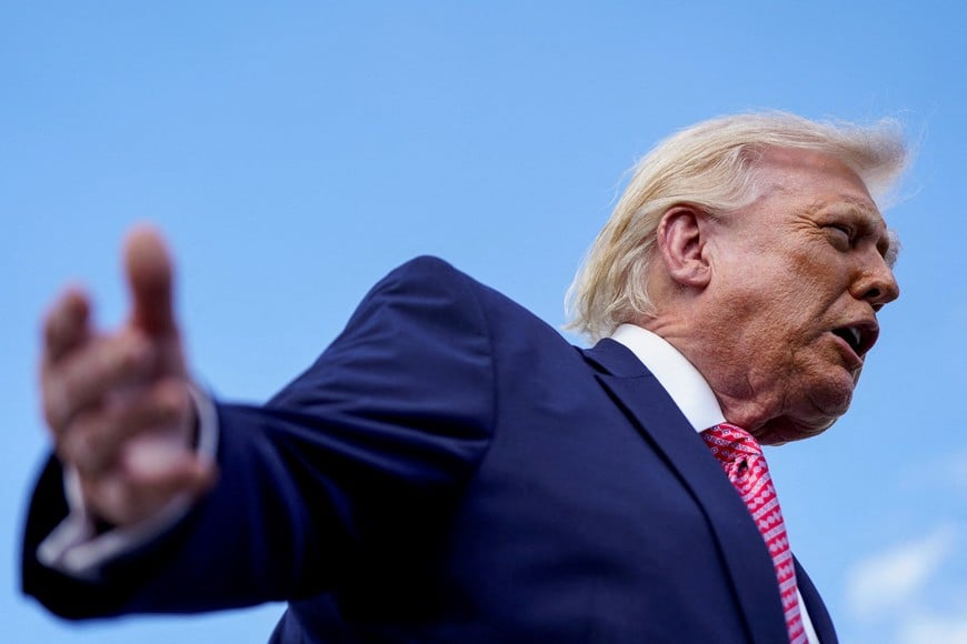 U.S. President Donald Trump speaks to the media as he arrives at Miami International Airport in Miami, Florida, U.S., March 27, 2026. REUTERS/Elizabeth Frantz

     TPX IMAGES OF THE DAY