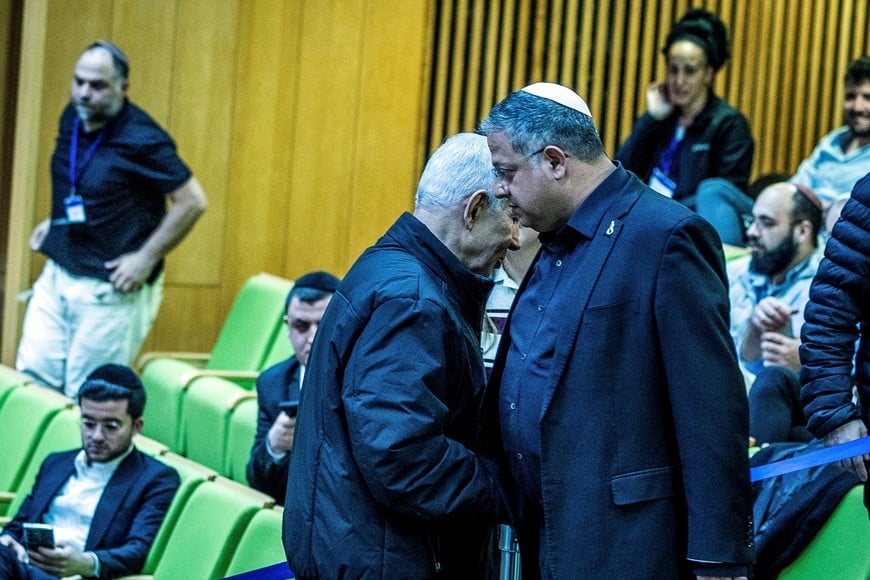 Israeli Prime Minister Benjamin Netanyahu and Israel's far-right National Security Minister Itamar Ben-Gvir shake hands as they attend a session at the Knesset, Israeli parliament, in Jerusalem March 29, 2026 REUTERS/Oren Ben Hakoon ISRAEL OUT. NO COMMERCIAL OR EDITORIAL SALES IN ISRAEL