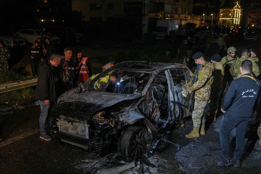 Emergency personnel operate around a burned car following a targeted Israeli strike, amid escalating hostilities between Israel and Hezbollah, as the U.S.-Israel conflict with Iran continues, in Khaldeh, Lebanon, March 31, 2026. REUTERS/Stringer