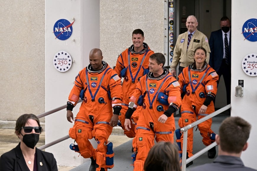 The crew of the Artemis II launch mission to fly by the moon, NASA astronauts Reid Wiseman, Victor Glover and Christina Koch and CSA (Canadian Space Agency) astronaut Jeremy Hansen walk to board the astronaut van for their drive to launch pad 39B at the Kennedy Space Center in Cape Canaveral, Florida, U.S. April 1, 2026.  REUTERS/Steve Nesius     TPX IMAGES OF THE DAY