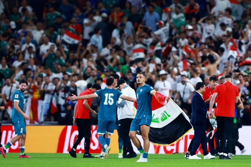 Soccer Football - FIFA World Cup - Inter-Confederation Playoffs - Final - Iraq v Bolivia - Estadio Monterrey, Monterrey, Mexico - March 31, 2026
Iran's Ali Al-Hamadi celebrates with the national flag after qualifying for the FIFA World Cup REUTERS/Raquel Cunha