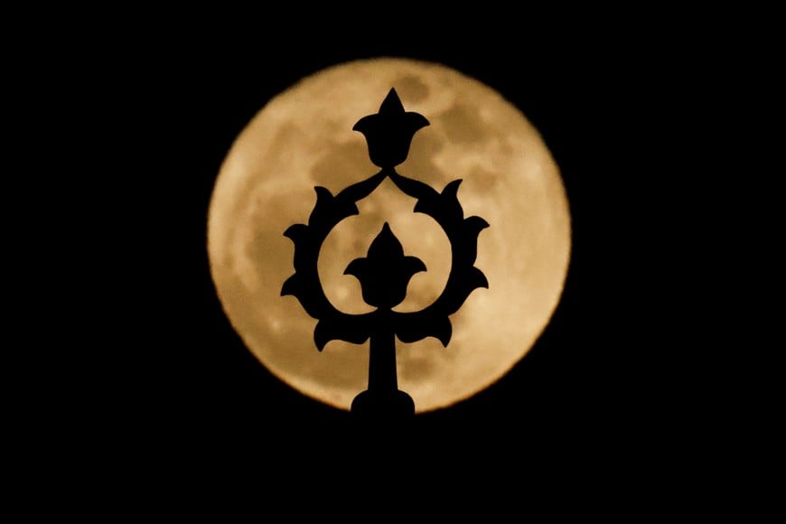 A detail of a historic fountain is silhouetted against a full moon in Istanbul, Turkey, April 2, 2026. REUTERS/Kemal Aslan