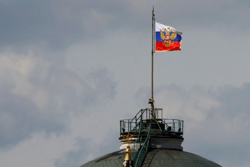 The Russian flag flies on the dome of the Kremlin Senate building, while the roof shows what appears to be marks from the recent drone incident, in central Moscow, Russia, May 4, 2023. REUTERS/Stringer