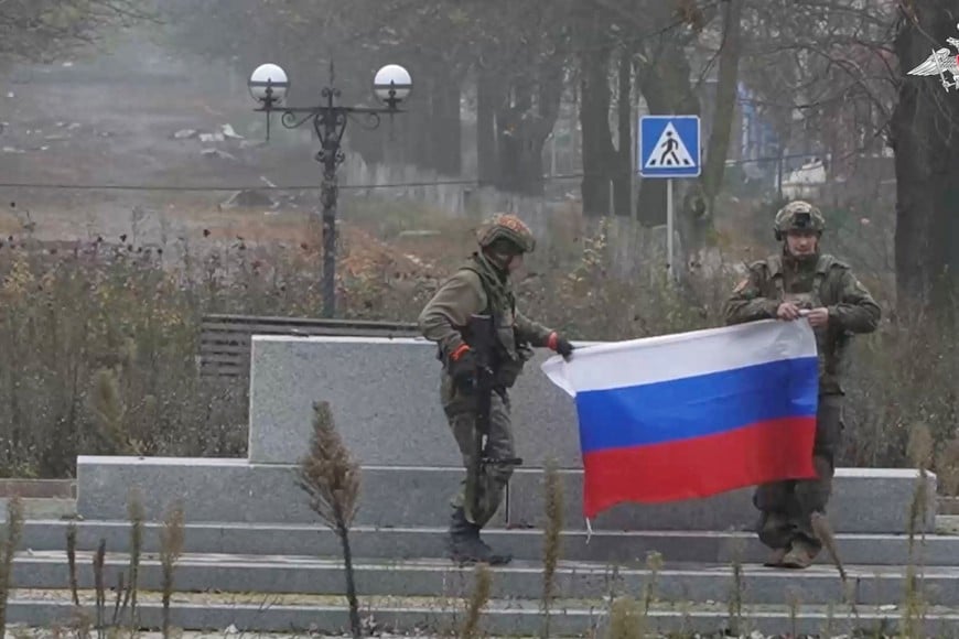 Soldiers hold a Russian flag in Pokrovsk, Donetsk Region, Ukraine, in this screengrab from video released December 1, 2025. Russian Defence Ministry/Handout via REUTERS    THIS IMAGE HAS BEEN SUPPLIED BY A THIRD PARTY. MUST NOT OBSCURE LOGO.

VERIFICATION:
- Reuters was able to confirm the location of the video as Pokrovsk from the buildings, the road layout and trees which matched file and satellite imagery of the area. 
- The date when the video was recorded could not be verified independently.