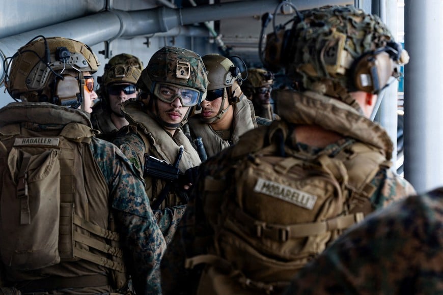 U.S. Marines conduct a live-fire exercise aboard amphibious assault ship USS Tripoli, at an undisclosed location in the U.S. Central Command area of responsibility, during the Operation Epic Fury attack on Iran March 27, 2026. U.S. Marine Corps/Handout via REUTERS THIS IMAGE HAS BEEN SUPPLIED BY A THIRD PARTY.