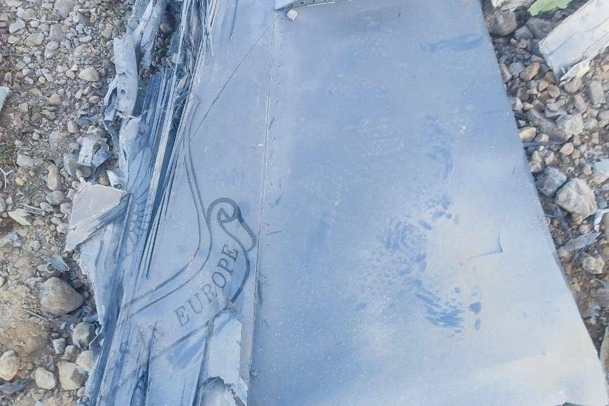 The Iranian state media said to show fragments of a downed U.S. jet in this picture said to be taken in central Iran and released on April 3, 2026. IRIB/Handout via REUTERS    THIS IMAGE HAS BEEN SUPPLIED BY A THIRD PARTY. IRAN OUT. NO COMMERCIAL OR EDITORIAL SALES IN IRAN. NO USE BBC PERSIAN. NO USE VOA PERSIAN. NO USE MANOTO. NO USE IRAN INTERNATIONAL. NO USE RADIO FARDA.  REFILE - CORRECTING FROM "JETS" TO "JET"

VERIFICATION:

-Reuters was not able to confirm the location or date when the photos were taken.

-The red stripe seen on the tail fin of the plane in the photos is consistent with the tail section of a F-15E Strike Eagle seen in file photos.