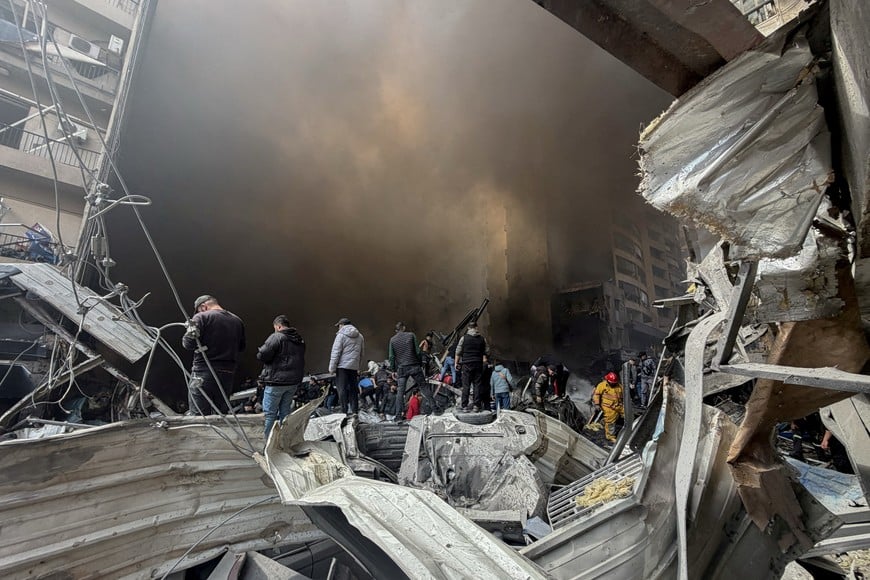 Smoke rises as people gather and rescuers work at the site of an Israeli strike in Beirut, Lebanon, April 8, 2026. Picture taken with a mobile phone. REUTERS/Stringer TPX IMAGES OF THE DAY