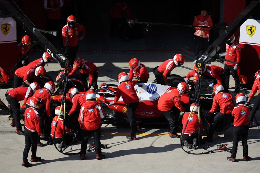 Formula One F1 - Chinese Grand Prix - Shanghai International Circuit, Shanghai, China - March 14, 2026
Ferrari mechanics with the car of Ferrari's Lewis Hamilton in the pit lane during qualifying REUTERS/Go Nakamura
