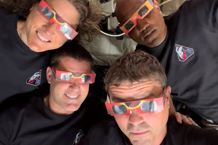 FILE PHOTO: The Artemis II crew of NASA astronauts Christina Koch, Reid Wiseman, Victor Glover and Canadian Space Agency (CSA) astronaut Jeremy Hansen pose with their eclipse glasses used to protect their eyes for the Orion spacecraft's flyby of the Moon April 6, 2026. Picture taken with a mobile phone. NASA/Handout via REUTERS
THIS IMAGE HAS BEEN SUPPLIED BY A THIRD PARTY/File Photo