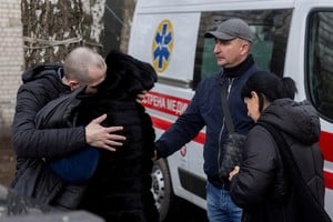 A woman embraces her son after his return from captivity after a prisoner of war (POW) swap, amid Russia's attack on Ukraine, in an undisclosed location in Ukraine, April 11, 2026. REUTERS/Thomas Peter