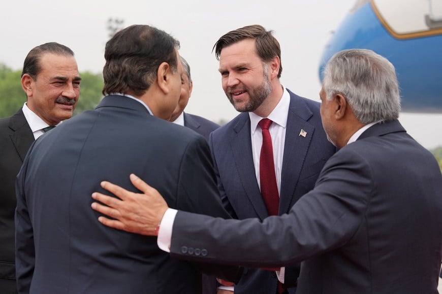 U.S. Vice President JD Vance is introduced to a Pakistani official by Pakistani Deputy Prime Minister and Foreign Minister Mohammad Ishaq Dar, as Pakistan's Chief of Defence Forces and Chief of Army Staff, Field Marshal Asim Munir, looks on, after arriving for talks with Iranian officials in Islamabad, Pakistan, Saturday, April 11, 2026.     Jacquelyn Martin/Pool via REUTERS