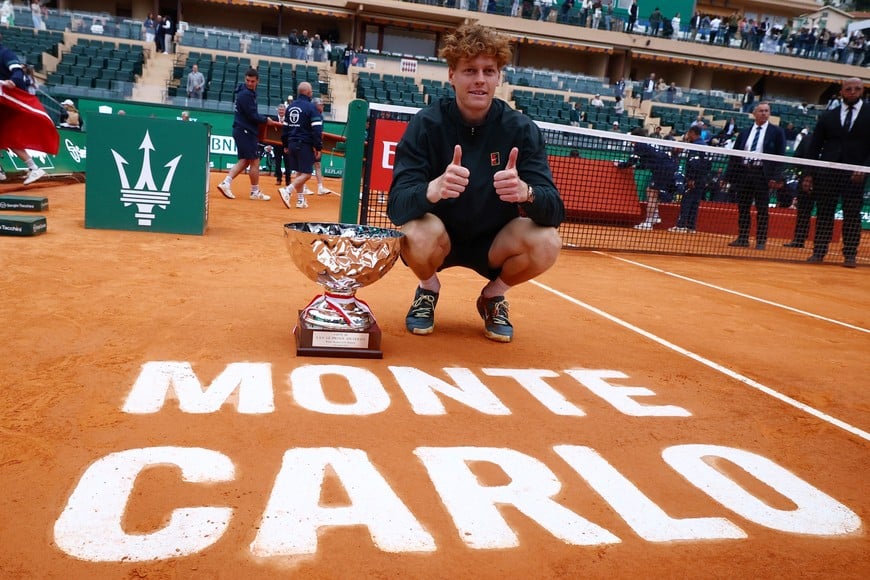 Tennis - ATP Masters 1000 - Monte Carlo Masters - Monte Carlo Country Club, Roquebrune-Cap-Martin, France - April 12, 2026
Italy's Jannik Sinner celebrates with the trophy after winning his final match against Spain's Carlos Alcaraz REUTERS/Manon Cruz
