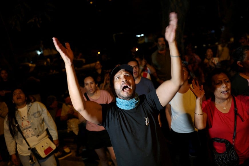 People protest outside the National Jury of Elections, expressing concerns over what they say was fraud in Peru’s general election, in Lima, Peru April 12, 2026. REUTERS/Manuel Orbegozo
