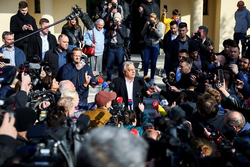 Hungarian Prime Minister Viktor Orban talks to journalists after casting his vote during the Hungarian parliamentary election in Budapest, Hungary, April 12, 2026. REUTERS/Lisi Niesner?