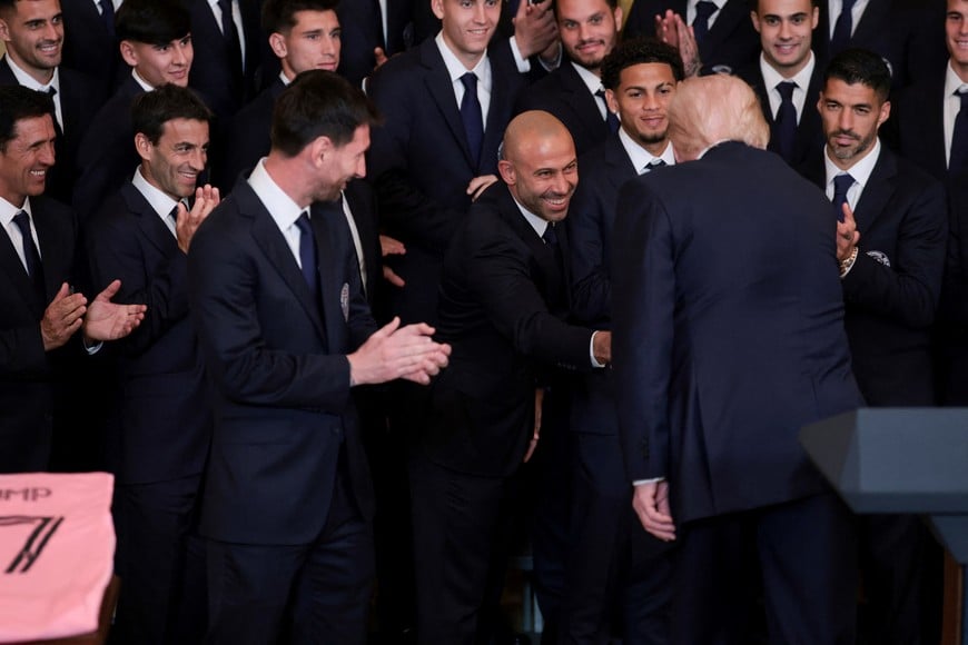 U.S. President Donald Trump shakes hands with Inter Miami CF head coach Javier Mascherano, on the day he honors reigning Major League Soccer (MLS) champion Inter Miami CF players and team officials with an event in the East Room of the White House in Washington, D.C., U.S., March 5, 2026. REUTERS/Jonathan Ernst