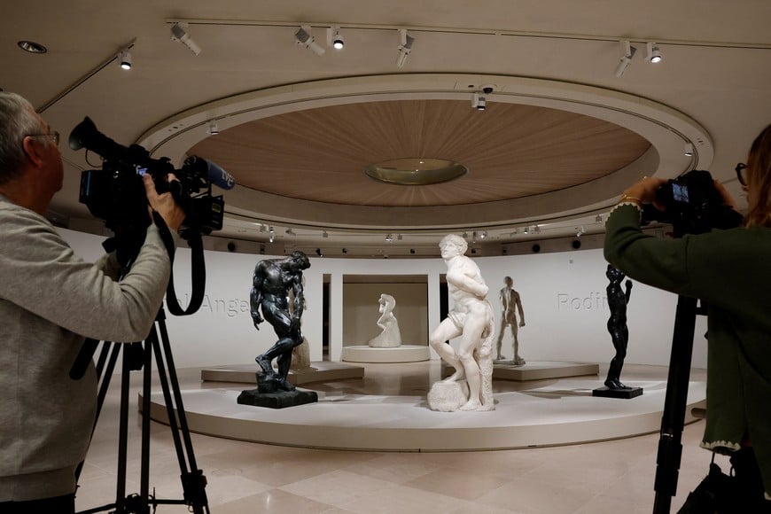 Adam (1880-1881) sculpture by French sculptor Auguste Rodin and the Rebellious Slave (1513-1515) sculpture by Italian Renaissance master Michelangelo stand on display during a press visit of the "Michelangelo and Rodin, Living bodies" exhibition at the Louvre museum in Paris, France, April 14, 2026. REUTERS/Benoit Tessier