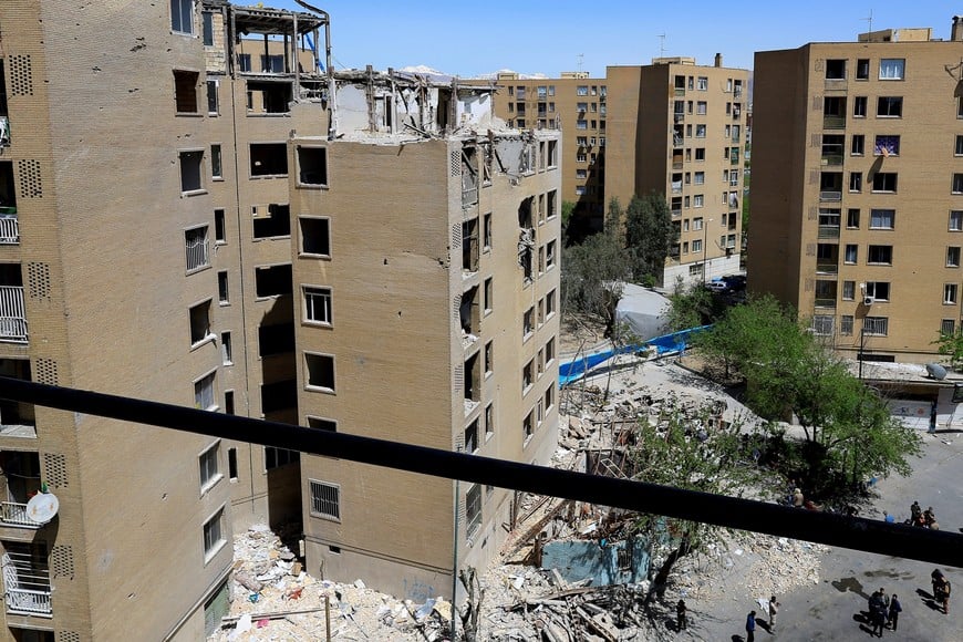 Residential buildings damaged by a strike on March 4, in Tehran, Iran, April 14, 2026. REUTERS/Thaier Al Sudani