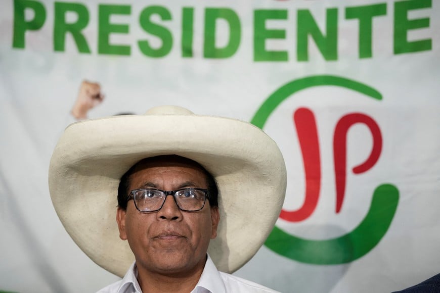Roberto Sanchez, presidential candidate of the Together for Peru party, speaks with members of the media as he waits for the election results after Peru's general election was extended to a second day in some precincts of the capital, in Lima, Peru, April 14, 2026. REUTERS/Angela Ponce